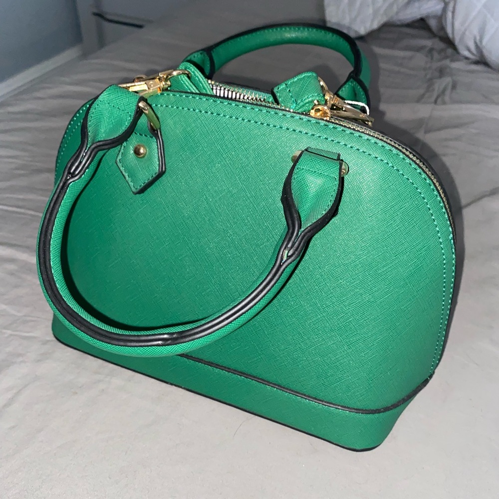 Small green bowler handbag with cross body strap